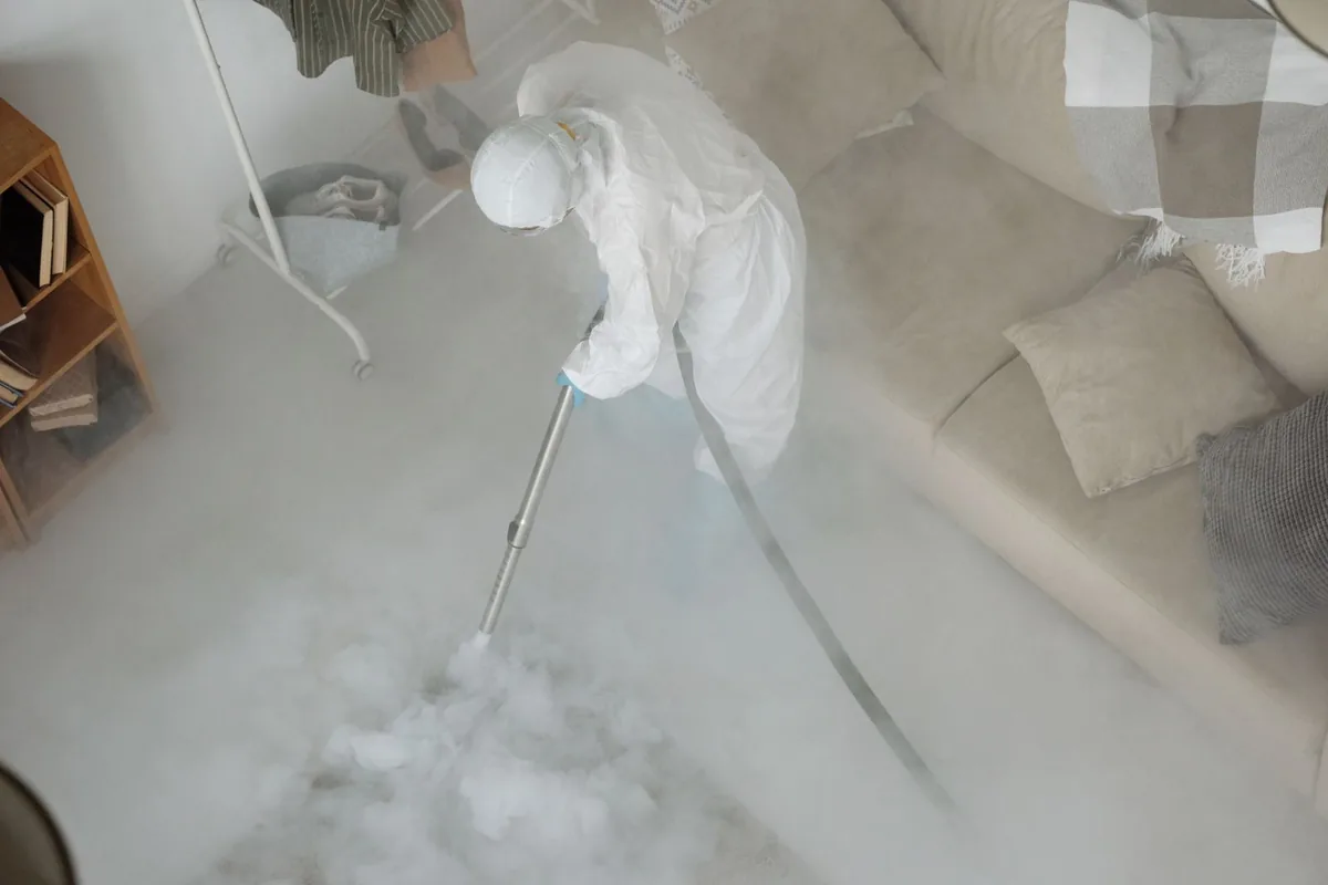 Biohazard cleanup technician in protective equipment, Rainbow Springs, FL